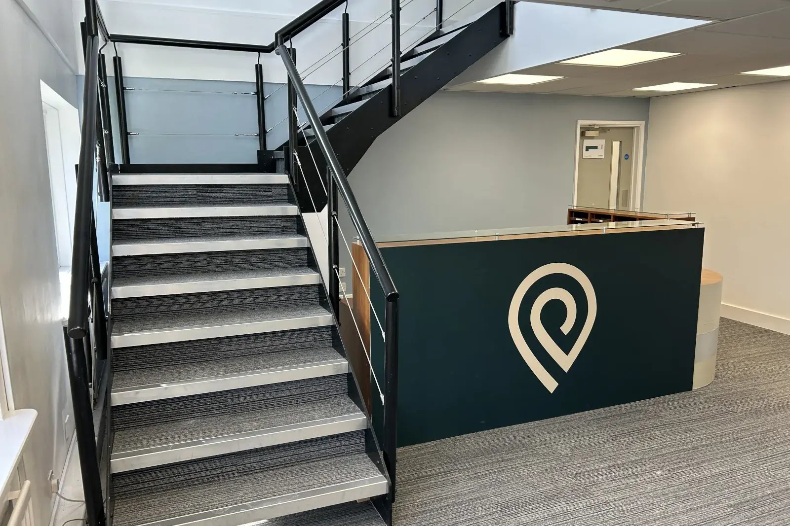 the-place-4-offices-alton-office-space-branded-front-desk-and-stairs-1600x1067