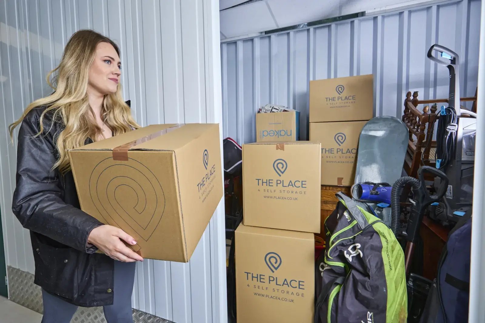 the-place-4-self-storage-customer-loading-another-box-to-their-secure-storage-unit-1600x1067