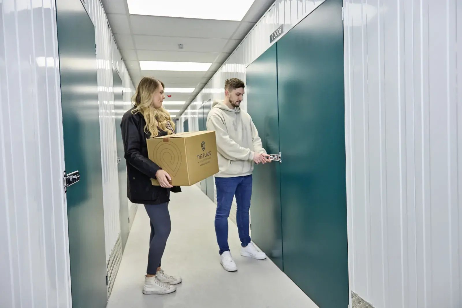 the-place-4-self-storage-customers-unlock-secure-storage-unit-ready-to-load-1600x1067