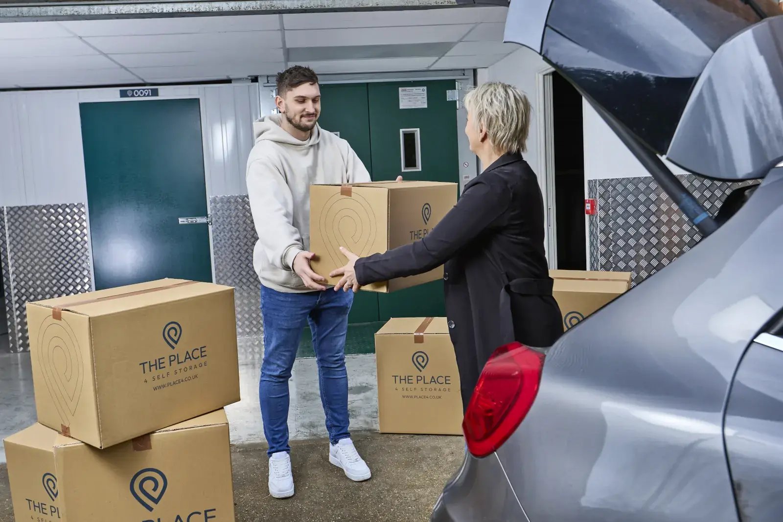 the-place-4-self-storage-unloading-packed-boxes-from-car-1600x1067