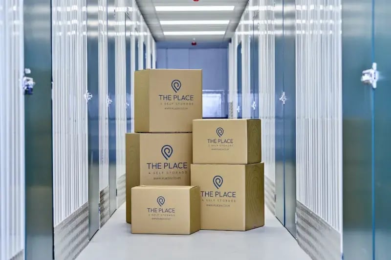 the-place-4-self-storage-branded-boxes-in-corridor-with-secure-storage-units-800x533