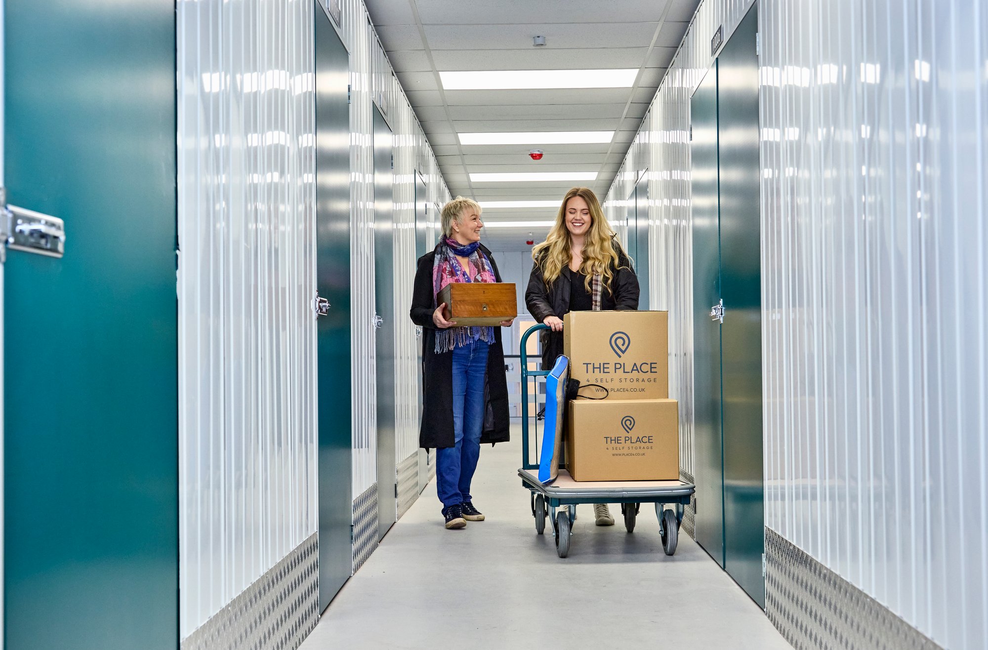 the place 4 self storage customers pushing trolley