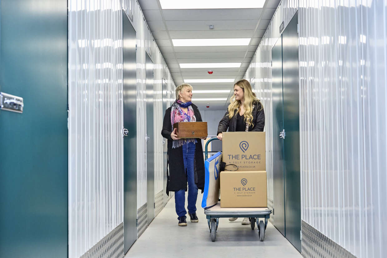 the-place-4-self-storage-customers-taking-possessions-to-storage-unit-1240x827