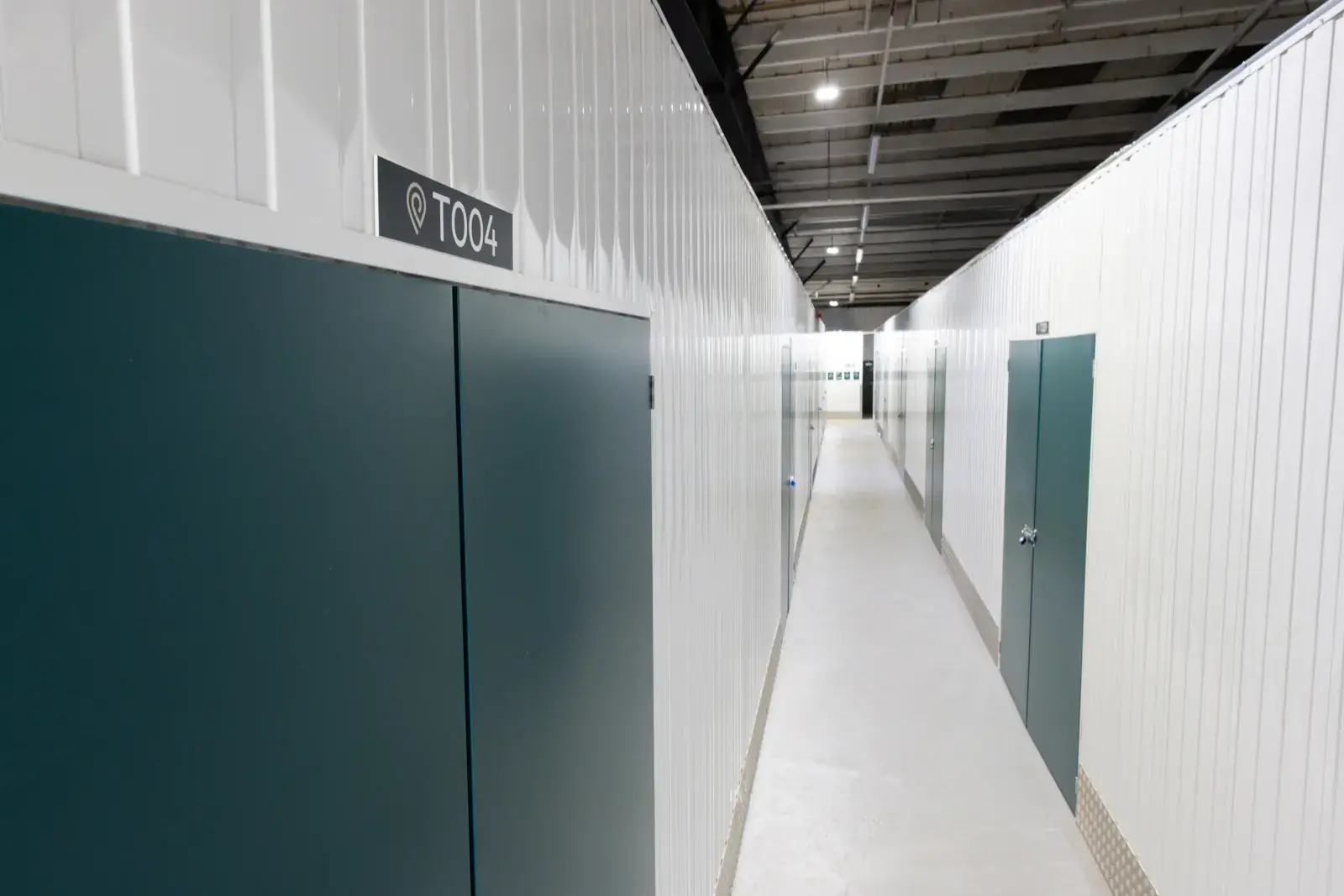 the-place-4-self-storage-swindon-storage-unit-space-corridor-with-numbered-units-1600x1067