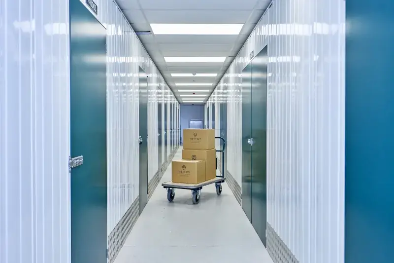the-place-4-self-storage-corridor-with-trolley-and-branded-boxes-800x533